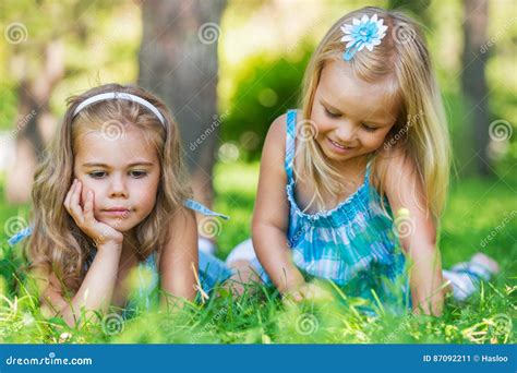 Two Little Sisters Having Fun In Summer Park Stock Image Image Of