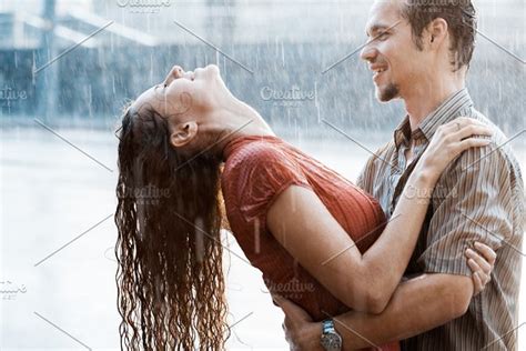 couple running in the rain high quality people images ~ creative market