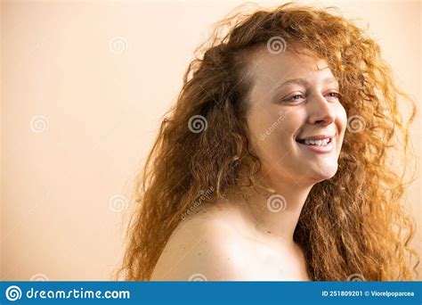 Side View Photo Of A Laughing Happy Redhead Woman With Curls Having