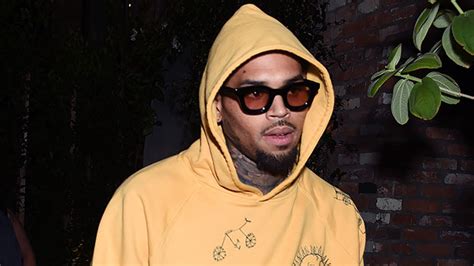 chris brown flexes in 24kt gold grills worth nearly 100k