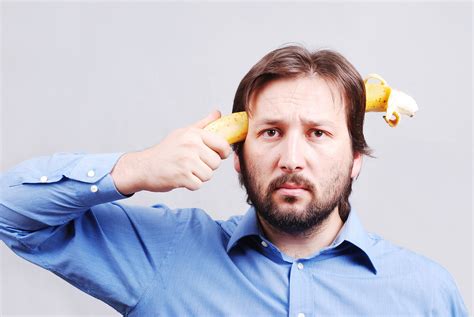 young man blowing   brain  banana royalty  stock image