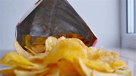 potato chips in package rotating open package of potato chips on the