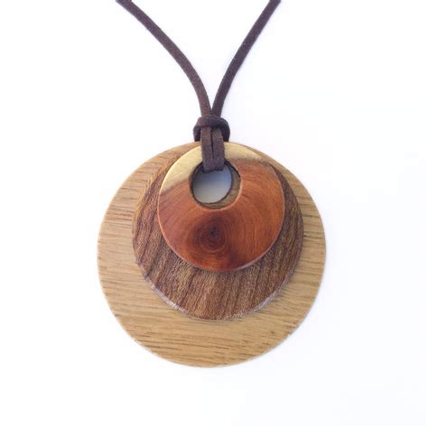layered pendant  scottish wood  wood hut beautifully handcrafted wooden rings