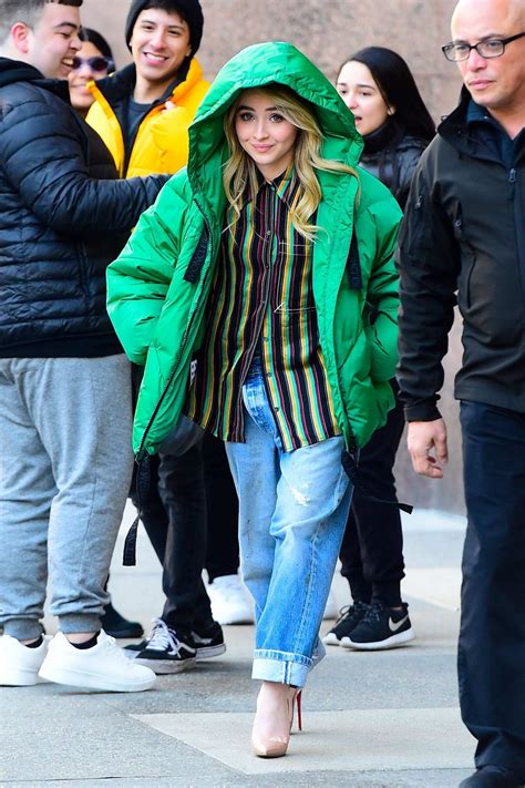 Sabrina Carpenter Wears A Green Puffer Jacket While Out In