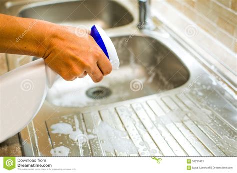 female hand  chores   kitchen  home spray multipurpose product stock image image