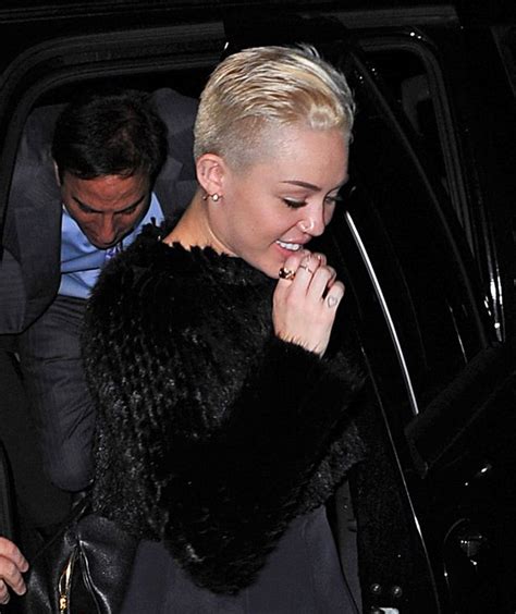 miley cyrus takes the shaven head look one step further plus the best