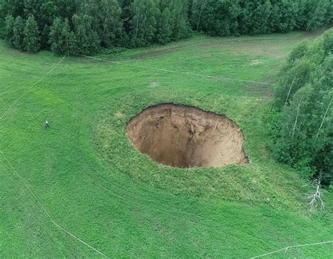 gate to hell terrified locals frantic as giant hole appears in field