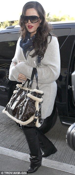 khloe kardashian pulls on her favourite givenchy fold over