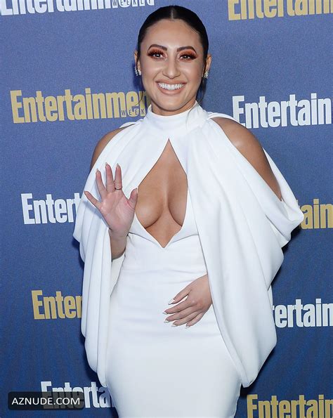 francia raisa showed off her cleavage posing in a white dress at the