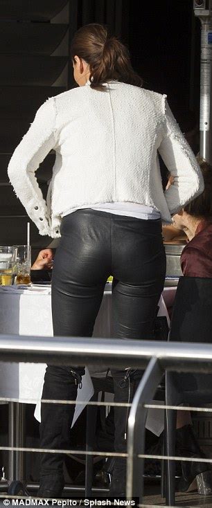 jodi anasta wears tight leather trousers with neighbours co star