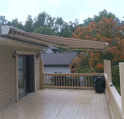 roof mount awning  blends beautifully   home  deck awning roof deck awnings