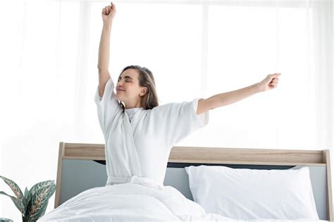 Premium Photo Woman Stretching After Waking Up In The Morning