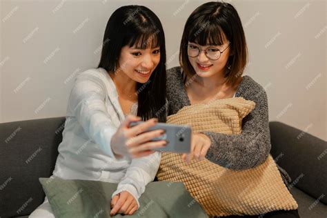 free photo pretty asian girls taking a selfie