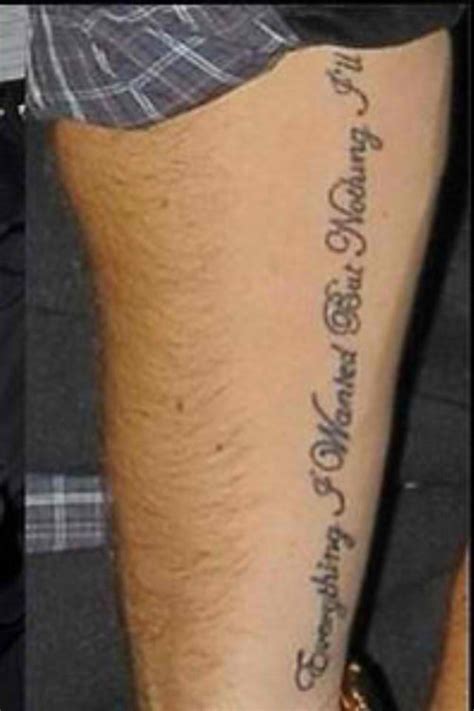 liam paynes   wanted arm tattoo
