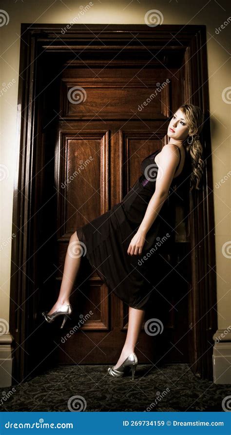 woman entering hotel door stock image image  dark