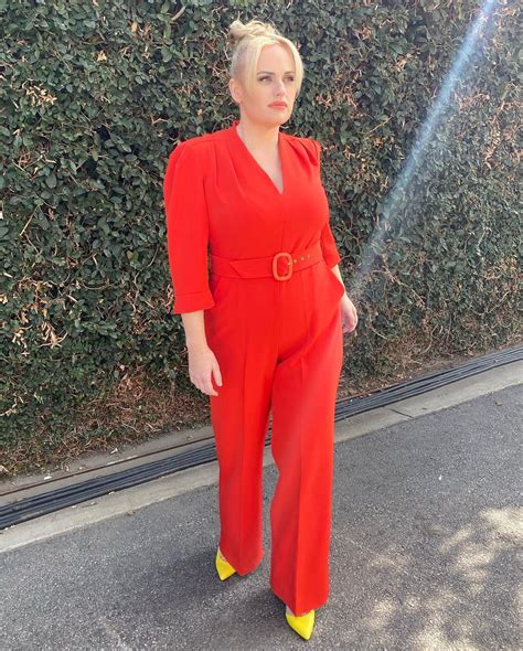 rebel wilson shows   lb weight loss  red jumpsuit