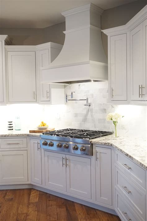 white shaker cabinets decorative range hood inset cabinet trendy kitchen backsplash