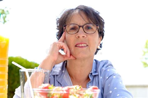 Portrait Of A Mature Brunette Woman With Eyeglasses Outdoor Stock