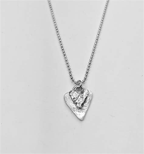 handcrafted textured double heart necklace skinny whistle shop