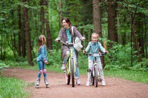mother and daughter riding bicycle at the park stock image image of