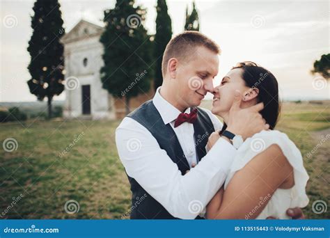 happy stylish smiling couple walking in tuscany italy on their stock