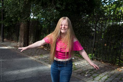 down syndrome girl smiling by stocksy contributor bowery image