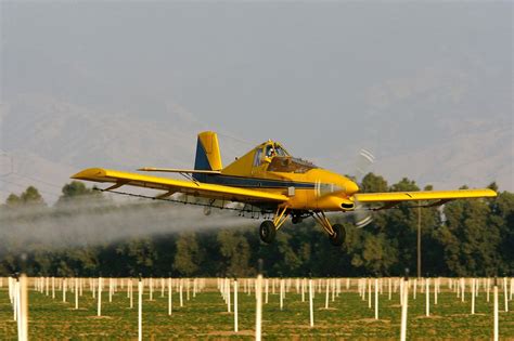 crop duster   spray louisiana town  holy water