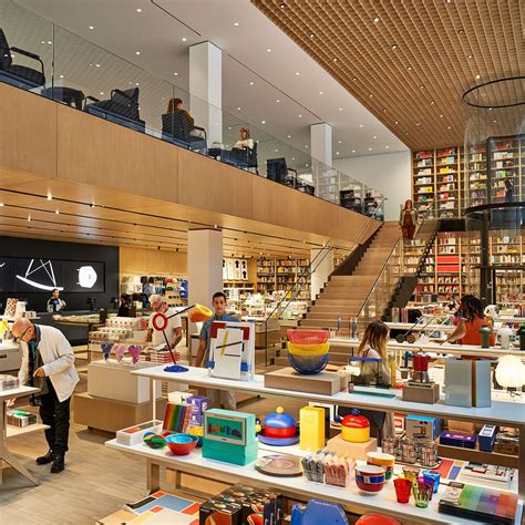 moma flagship store boasts   story bookshelf   books retail store design