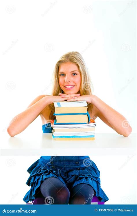 smiling teen girl holding hands  piles  books royalty  stock