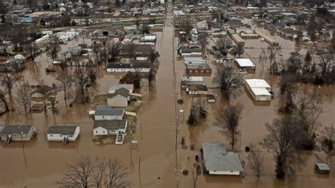 historic flooding kills 13 sparking evacuation road closures
