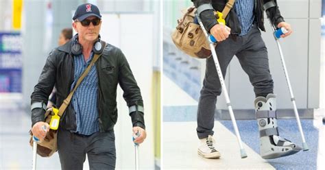daniel craig sports crutches after surgery as james bond filming pushed