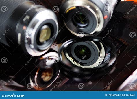 close    camera lenses  isolated circular filter  negative film strips stock photo