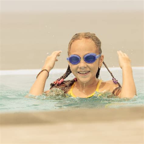 teen girl sitting   swimming pool stock photo image  cheerful face