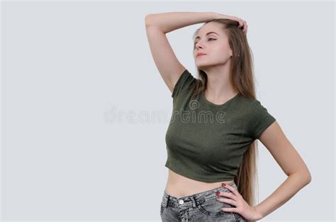 Nice Girl With Beautiful Breasts In A Green T Shirt Posing On Ca Stock