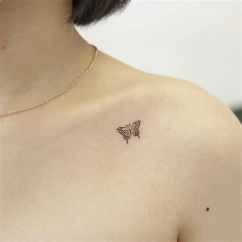 Fine Line Butterfly Tattoo On The Collarbone