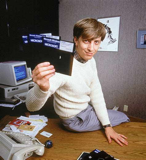 bill gates holding windows  installation floppy disks    interesting historical