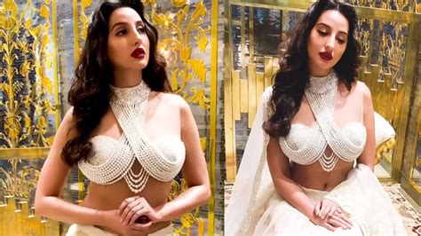 hottie alert nora fatehi burns the fashion quotient in sexy white