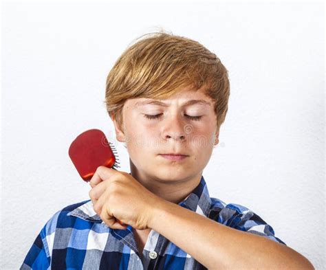 young boy brushing  hair stock image image   hair