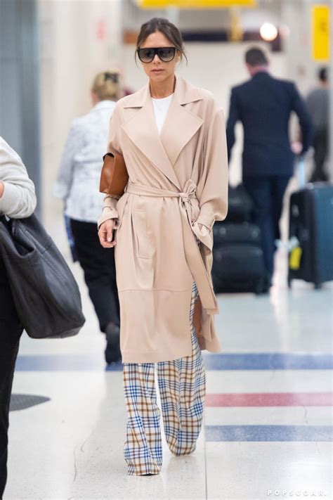 Victoria Beckham In Trench Coat And Plaid Pants Popsugar Fashion