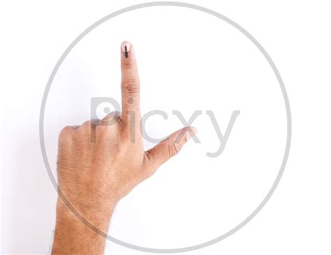 image of voter showing inked finger after casting vote in elections