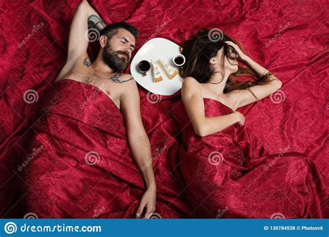 man and woman with half covered bodies have coffee stock