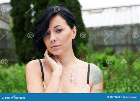 Pretty Black Haired Girl With Tattoo In The Garden Stock Image Image