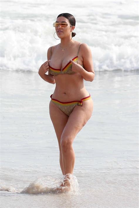 amazing new pictures show kim kardashian and kourtney in bikinis on the beach in candid glimpse