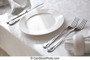 place setting    place setting including  white dinner plate