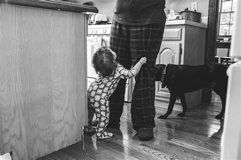 daughter tugging at moms pant leg allison park kitchen in their