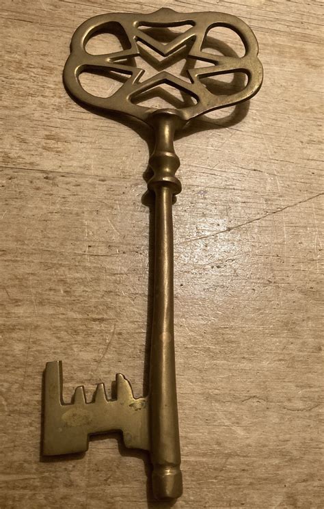 large solid brass fictional skeleton key approx  inches long etsy