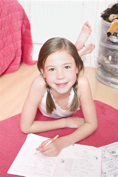 young girl  homework  floor stock image image