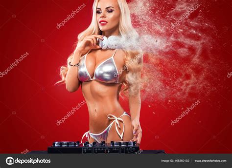 Portrait Of Sexy Topless Dj With Deck Playing Music On Red