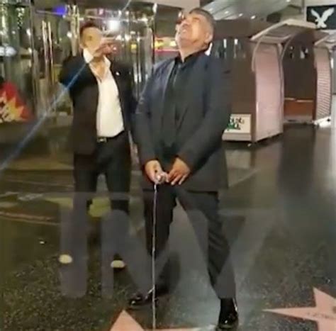 dlisted people  pissed george lopez pretended  pee  trumps walk  fame star