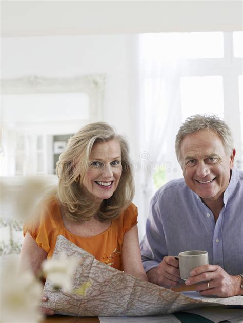 Mature Couple With Map At Home Stock Image Image Of